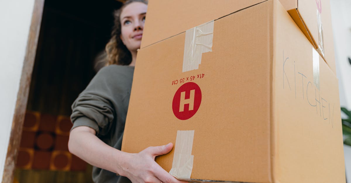 Place furthest away from an airport in the world? - Young female carrying cardboard boxes while moving out of house Place furthest away from an airport in the world? - Young female carrying cardboard boxes while moving out of house