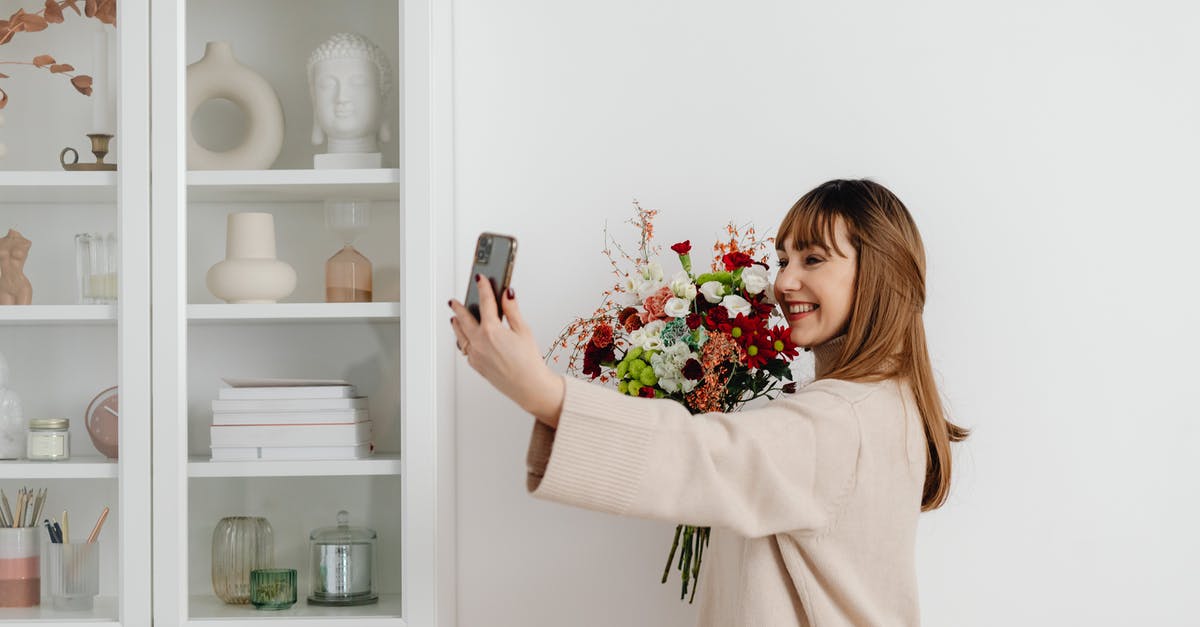 Places to take pictures of flowers in San Diego - Happy Woman Taking Photo with Flowers Places to take pictures of flowers in San Diego - Happy Woman Taking Photo with Flowers