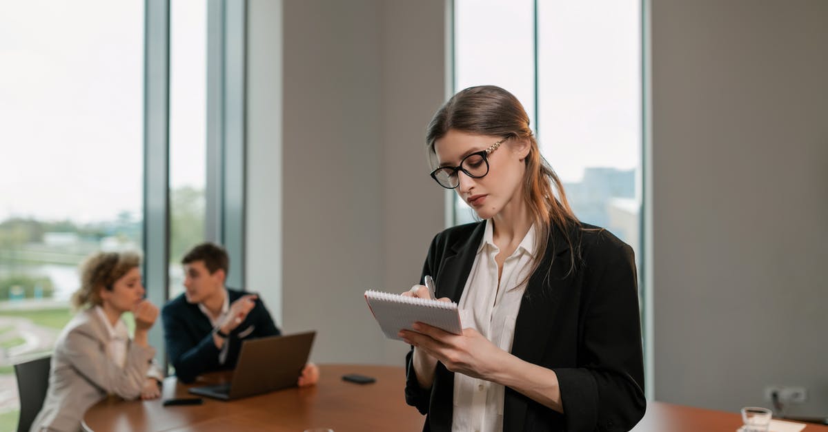 Planning a cruise - Woman in Black Blazer Writing on Notebook Planning a cruise - Woman in Black Blazer Writing on Notebook