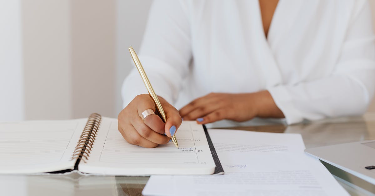 Planning to ask a long-term visa after tourism visa: which documents to pass the border? [closed] - Person in White Top Writing on Notebook