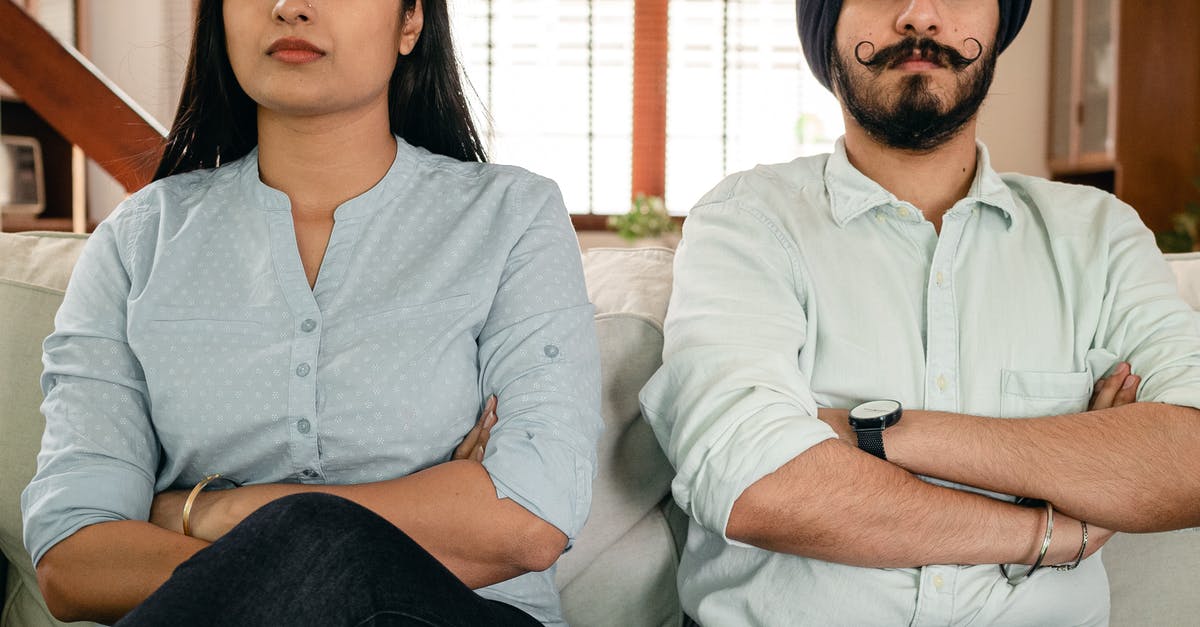 Poland : Effects of Negative Decision of Temporary Residence application on Future Schengen Visas [closed] - Crop thoughtful young man and woman in casual clothes sitting on sofa with crossed arms after having argue