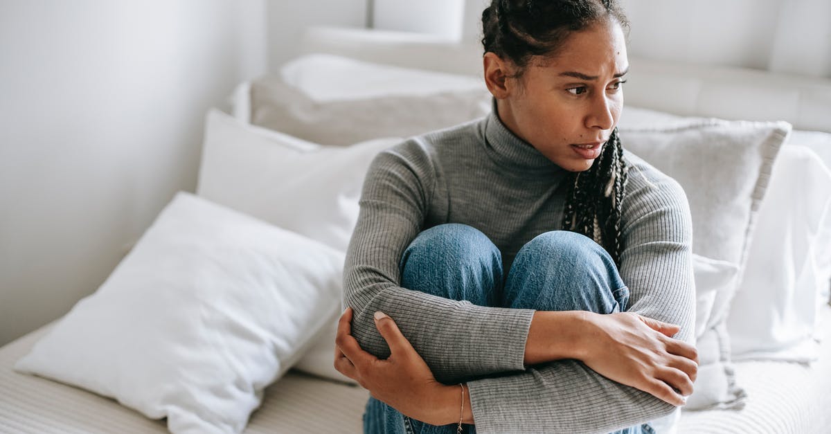 Poland : Effects of Negative Decision of Temporary Residence application on Future Schengen Visas [closed] - Ethnic woman embracing knees and suffering from anxiety