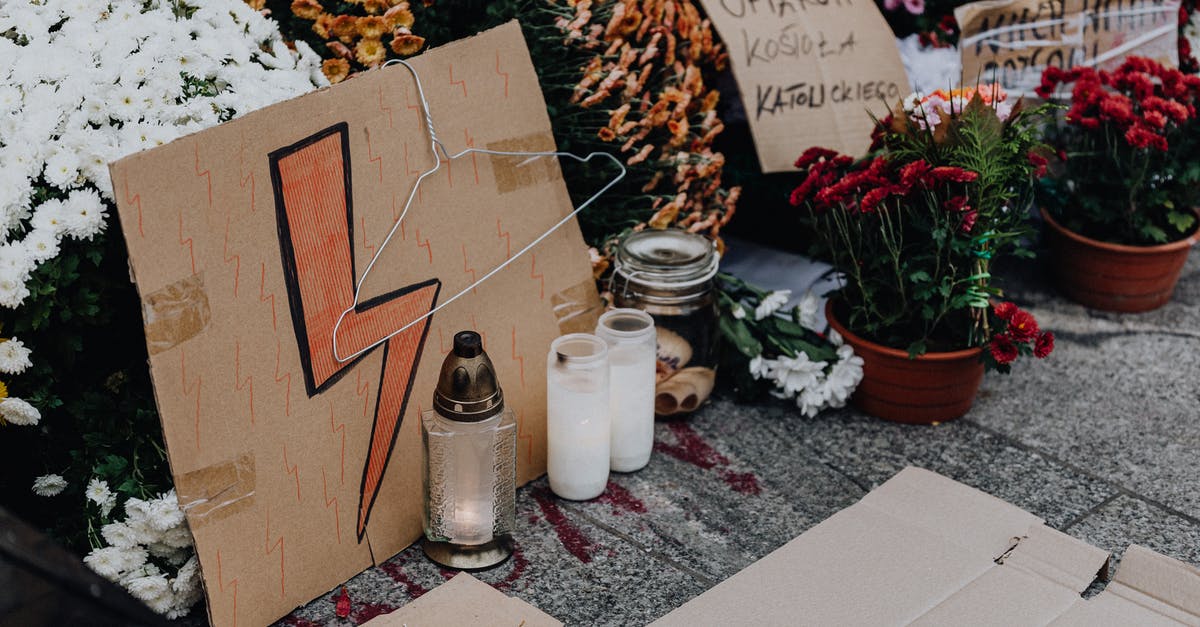 Polish-Born Canadian entering Poland - White Ceramic Jars on White Table Polish-Born Canadian entering Poland - White Ceramic Jars on White Table
