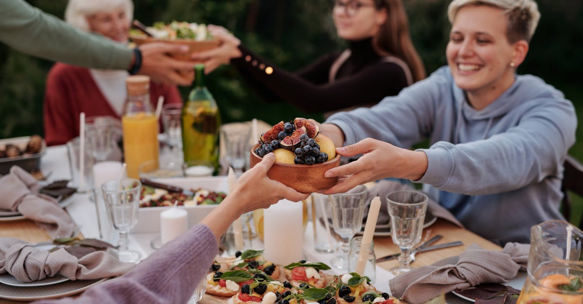 Possibility of getting my schengen visa revoked if other family members not going? - Woman in Hoodie Jacket Holding a Bowl of Fruits Possibility of getting my schengen visa revoked if other family members not going? - Woman in Hoodie Jacket Holding a Bowl of Fruits
