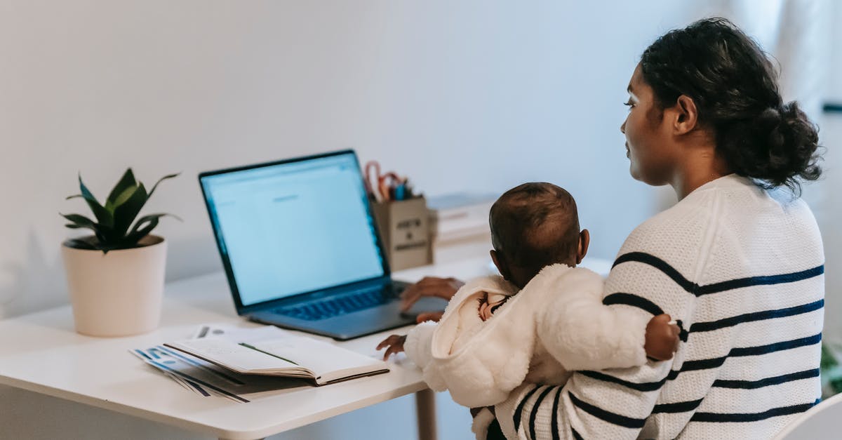 Possible issues when carrying multiple laptops/phones from India to Canada? - Pensive ethnic woman in casual clothes slitting with baby while browsing netbook in light room in apartment in daytime Possible issues when carrying multiple laptops/phones from India to Canada? - Pensive ethnic woman in casual clothes slitting with baby while browsing netbook in light room in apartment in daytime