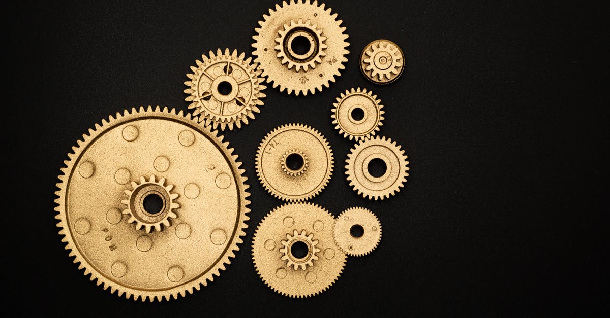 Power plugs in train repeatedly turning off - Photo of Golden Cogwheel on Black Background Power plugs in train repeatedly turning off - Photo of Golden Cogwheel on Black Background