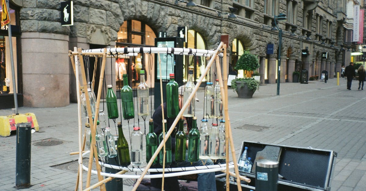 Practical implication of Judgment in Case C-754/18 to family members of EU citizens according to EU 2004/38/EC [closed] - Person Sitting Near Hanging Bottles and Opened Box