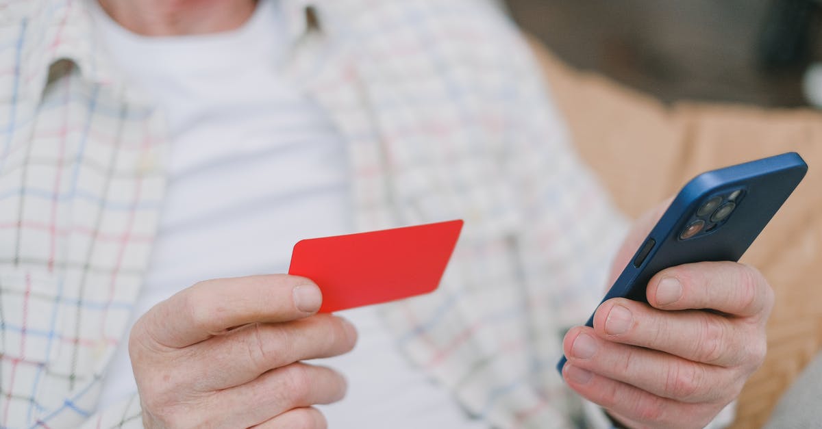 Prepaid cellphone (Handy) or SIM card for Germany, Czech Republic, Austria and Hungary? - A Person's Hands Holding a Card and a Cell Phone Prepaid cellphone (Handy) or SIM card for Germany, Czech Republic, Austria and Hungary? - A Person's Hands Holding a Card and a Cell Phone