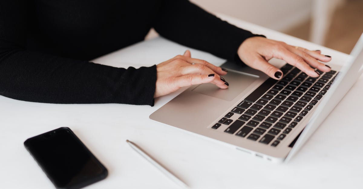 Prepaid Data Plan for cell phone in Italy - Crop faceless woman working on netbook in office Prepaid Data Plan for cell phone in Italy - Crop faceless woman working on netbook in office