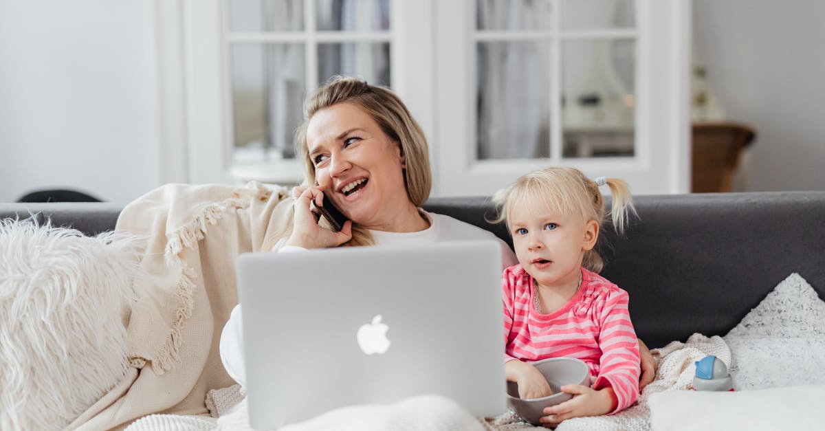 Prepaid mobile phone prices in Montevideo, Uruguay - Woman Talking on Phone on Sofa with Girl