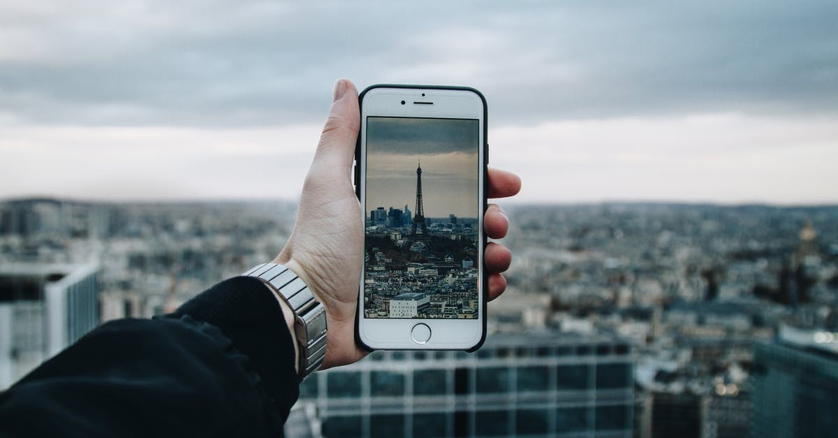 Prepaid mobile sim that will work for Paris and London - Man Taking Picture Of The City Prepaid mobile sim that will work for Paris and London - Man Taking Picture Of The City