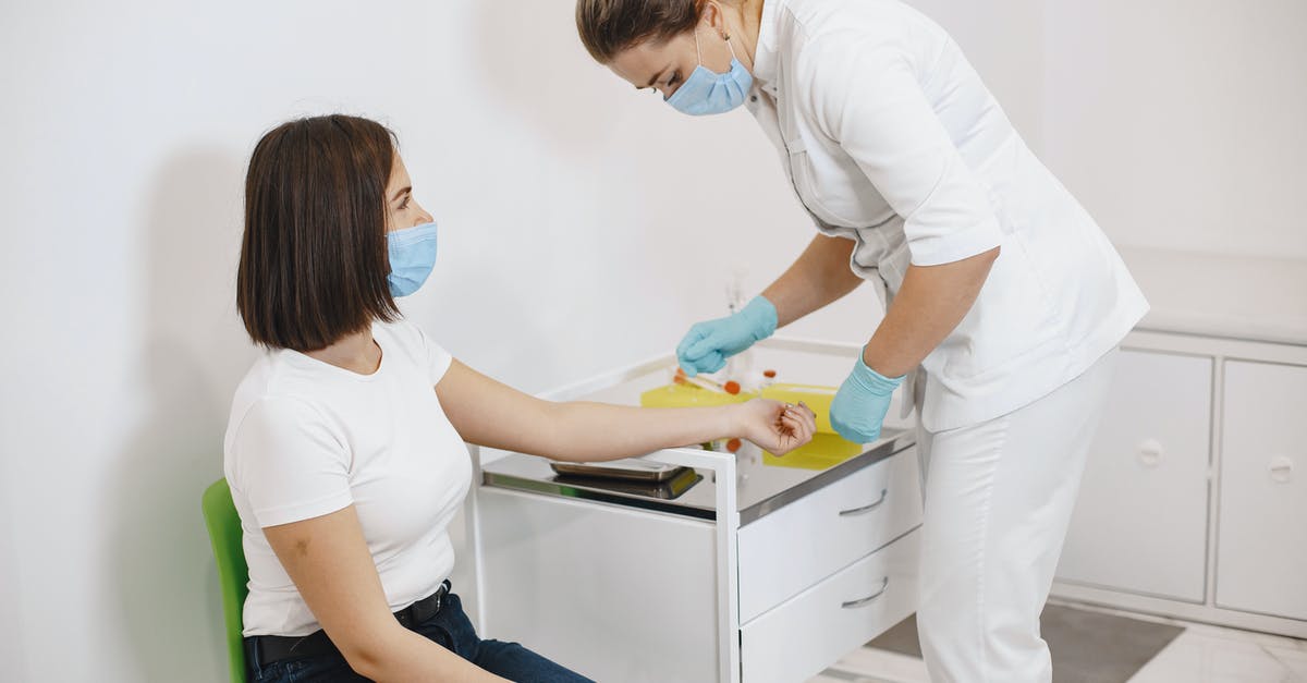 Preparing for Greece to Exit the EU (Grexit) - Nurse Preparing Woman for Vaccination Preparing for Greece to Exit the EU (Grexit) - Nurse Preparing Woman for Vaccination