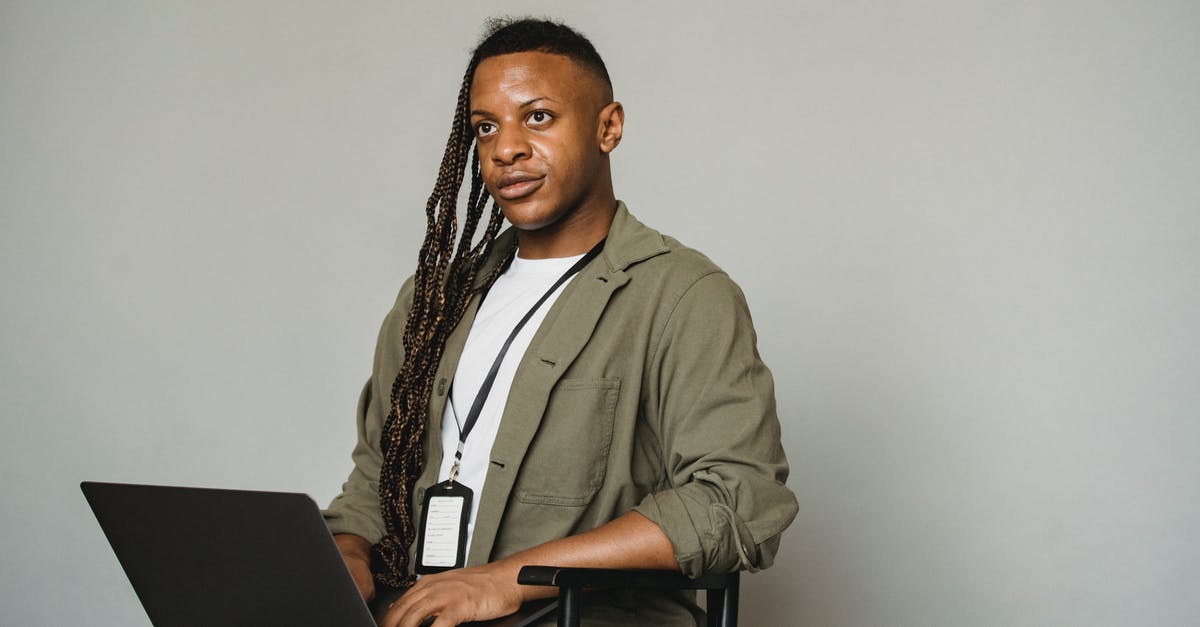 Prevalence of ATMs that accept JCB cards - Black transgender man working on laptop Prevalence of ATMs that accept JCB cards - Black transgender man working on laptop