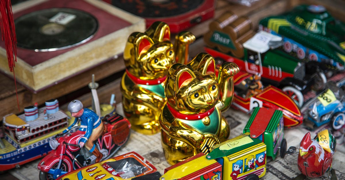 Price of train tickets in Geneva - Collection of vintage toys on shelf Price of train tickets in Geneva - Collection of vintage toys on shelf