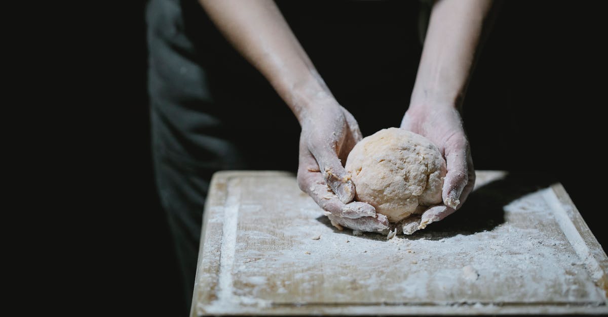 Primary occupation for DS-160 Form (US visa) for a self-employed person - From above of crop anonymous cook kneading dough on wooden board with flour