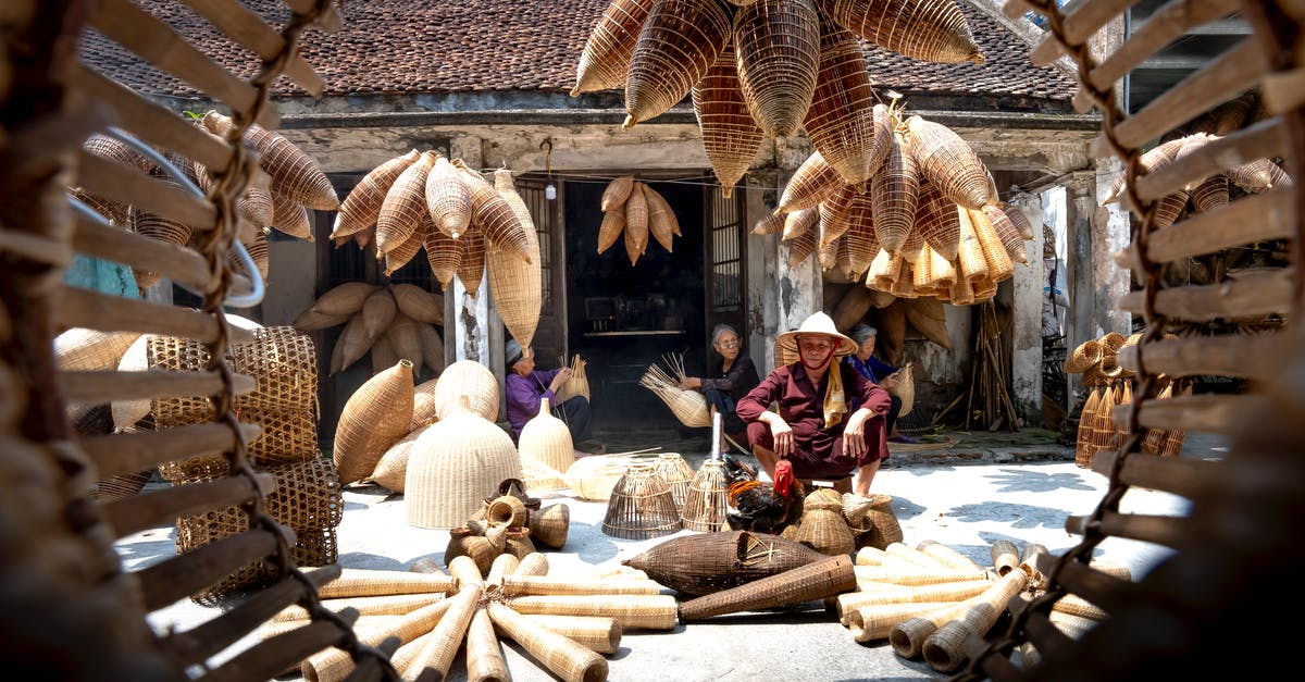 Primary occupation for DS-160 Form (US visa) for a self-employed person - Vietnamese senior people in yard among bamboo traditional fish traps