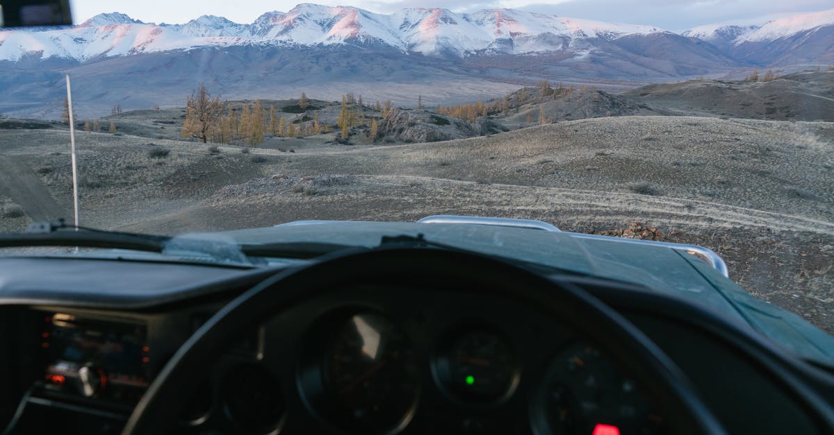 Proof of onward travel in Japan? - Mountains against blue sky seen from inside of car Proof of onward travel in Japan? - Mountains against blue sky seen from inside of car