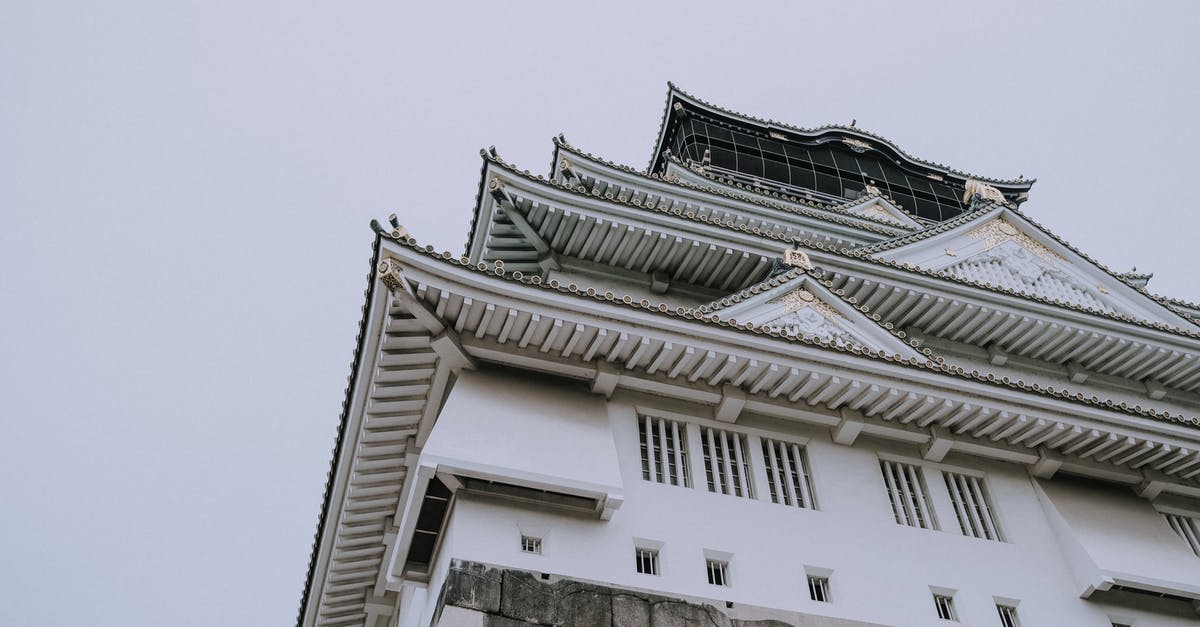 Proof of onward travel in Japan? - White and Black Concrete Building Proof of onward travel in Japan? - White and Black Concrete Building