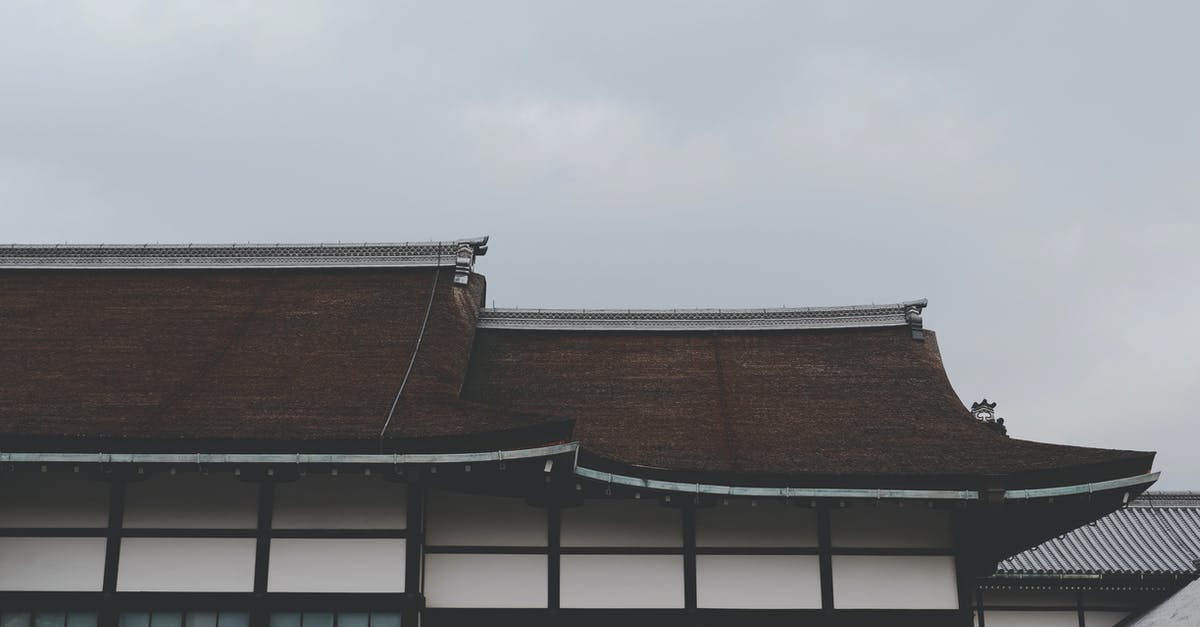 Proof of sufficient funds for transit in Japan - Brown and White Concrete Building