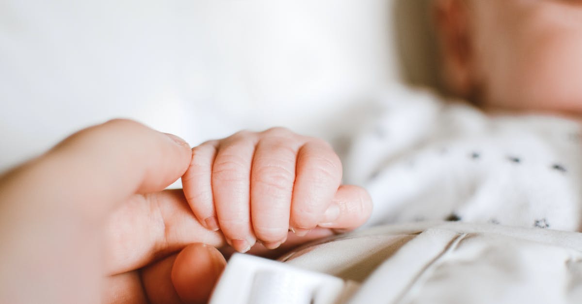 Protocol for opposite gender parent accompanying young children into public toilet [closed] - Person Holding Baby's Hand