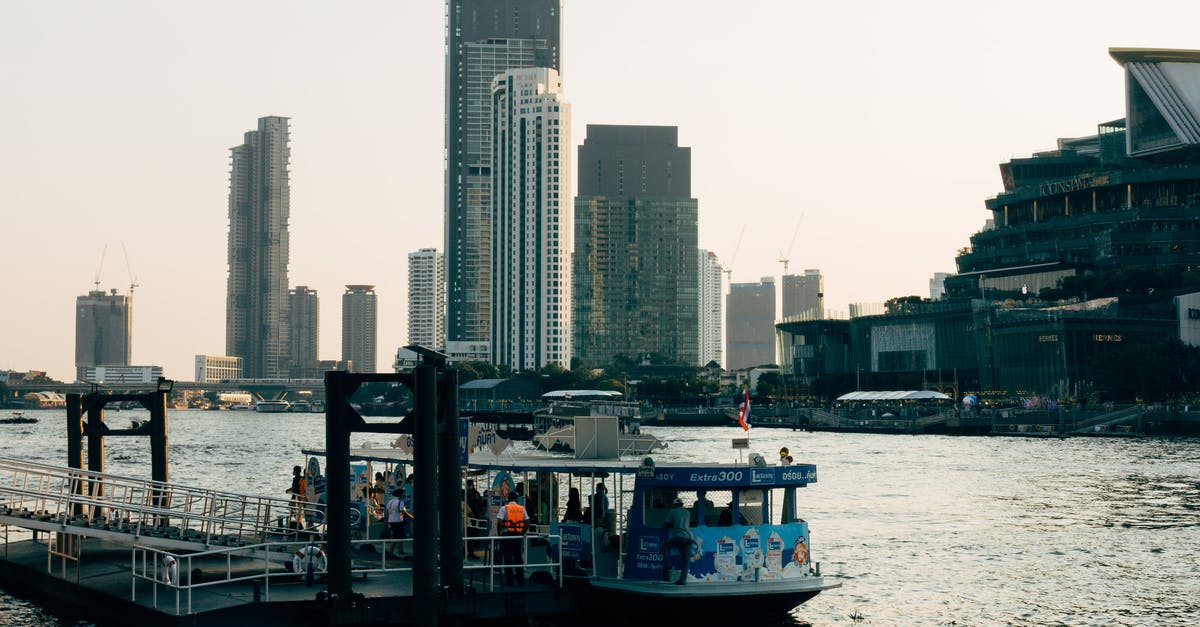 Proving onward travel on a South America tour - White Boat on Water Near City Buildings Proving onward travel on a South America tour - White Boat on Water Near City Buildings