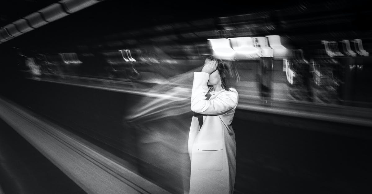 Public transport in Warsaw - time tickets - Faceless woman waiting for metro cabin in subway Public transport in Warsaw - time tickets - Faceless woman waiting for metro cabin in subway