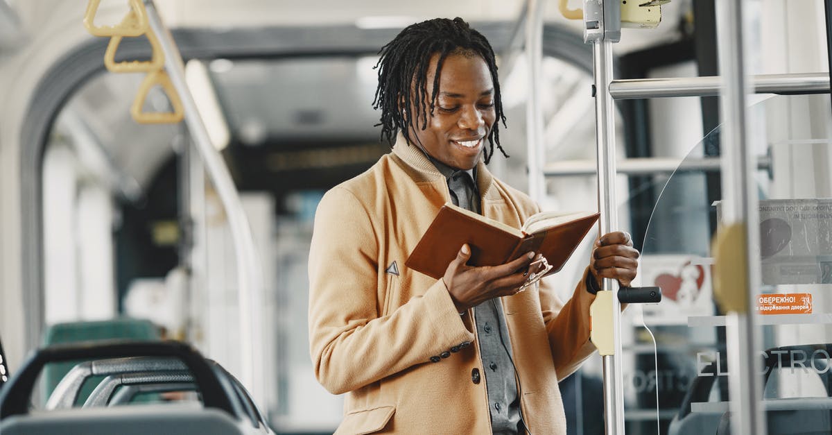 Public Transport planner for Hanover (Hannover)? - Man Reading Book in Public Transport Public Transport planner for Hanover (Hannover)? - Man Reading Book in Public Transport