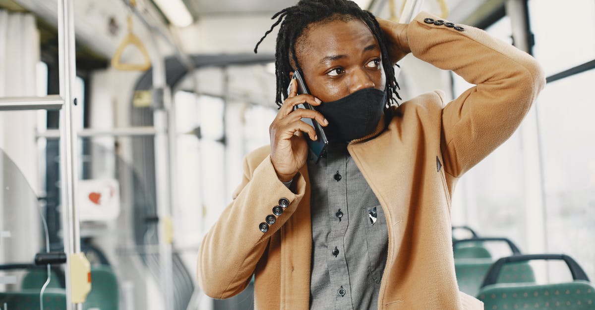 Public Transport planner for Hanover (Hannover)? - Young Man in Face Mask Talking on Phone in Bus Public Transport planner for Hanover (Hannover)? - Young Man in Face Mask Talking on Phone in Bus