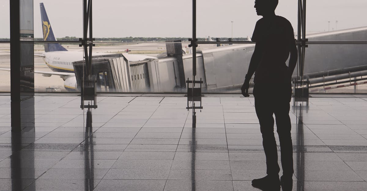 Puerto Rico Atlanta Airport non-US traveler - Silhouette of Man Inside Concrete Building Puerto Rico Atlanta Airport non-US traveler - Silhouette of Man Inside Concrete Building