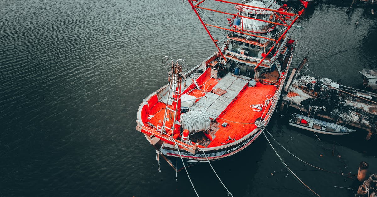 Punctuality of the Ferry from Dubrovnik to Rijeka - Fishing ship moored in dock with boats Punctuality of the Ferry from Dubrovnik to Rijeka - Fishing ship moored in dock with boats