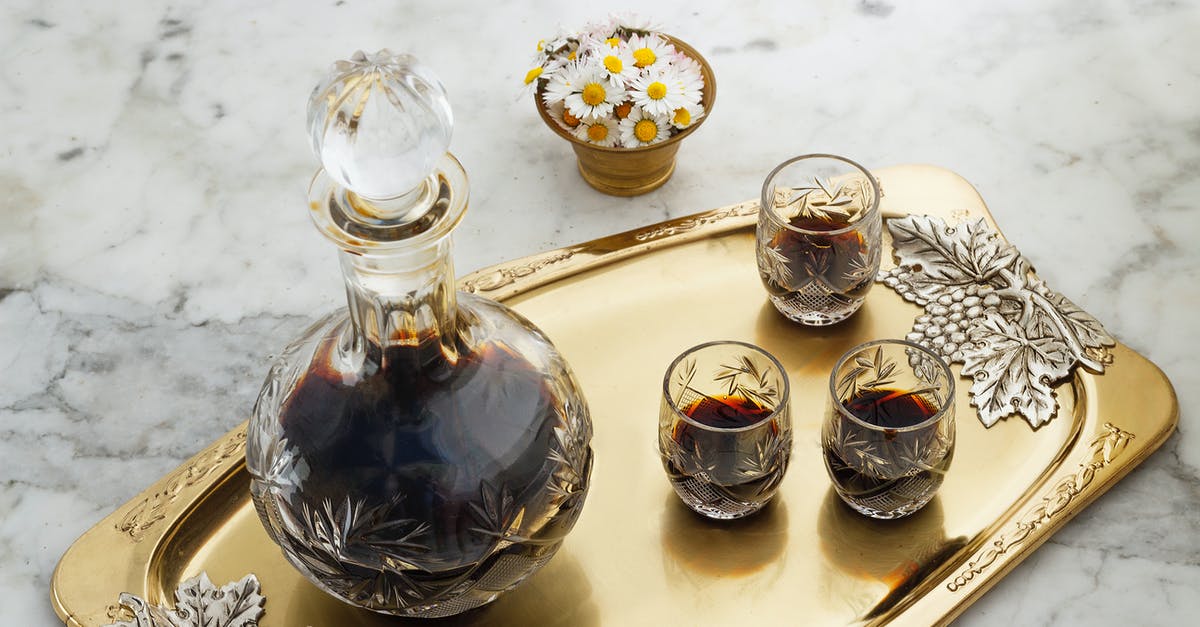 Purchasing a bottle of wine after security over 100 ml - Clear Glass Pitcher with Brown Liquid on Golden Tray Purchasing a bottle of wine after security over 100 ml - Clear Glass Pitcher with Brown Liquid on Golden Tray