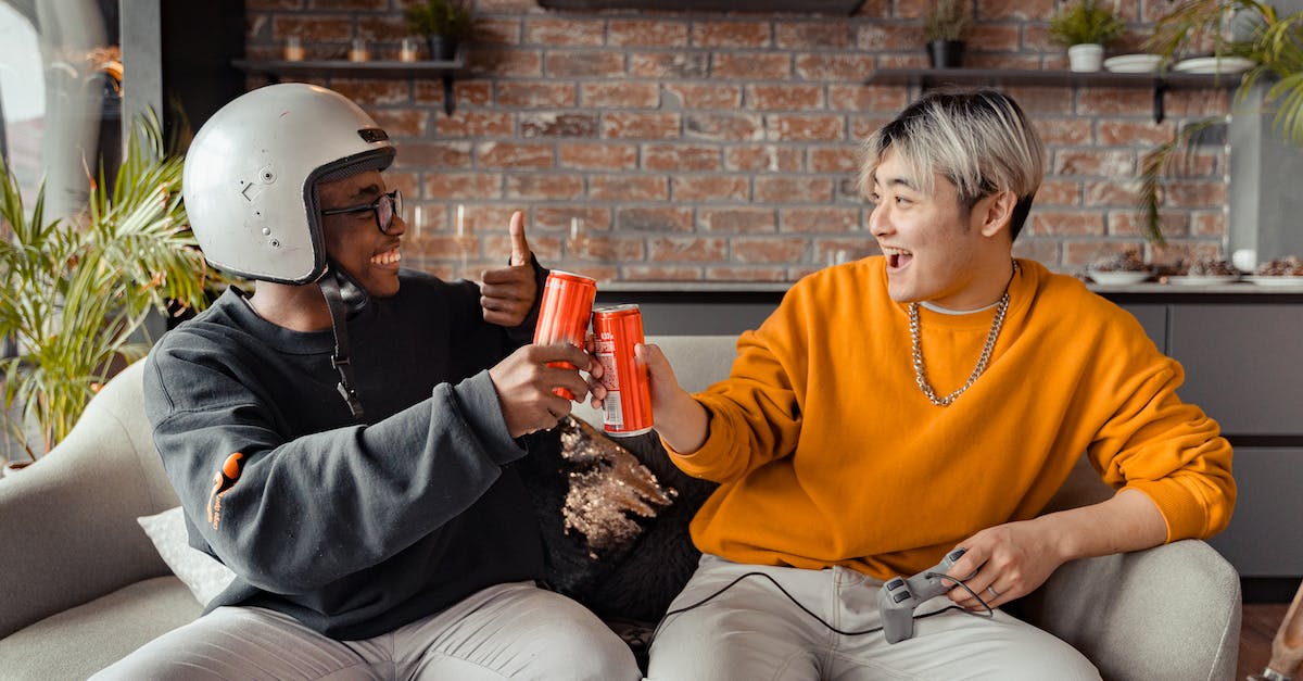 Putting a hold on an airline seat - Interracial Men Making a Toast Putting a hold on an airline seat - Interracial Men Making a Toast