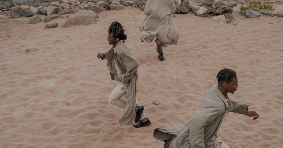 Qantas Carbon offsets are different in different directions - why? - Men on Beach Running in Different Directions Qantas Carbon offsets are different in different directions - why? - Men on Beach Running in Different Directions