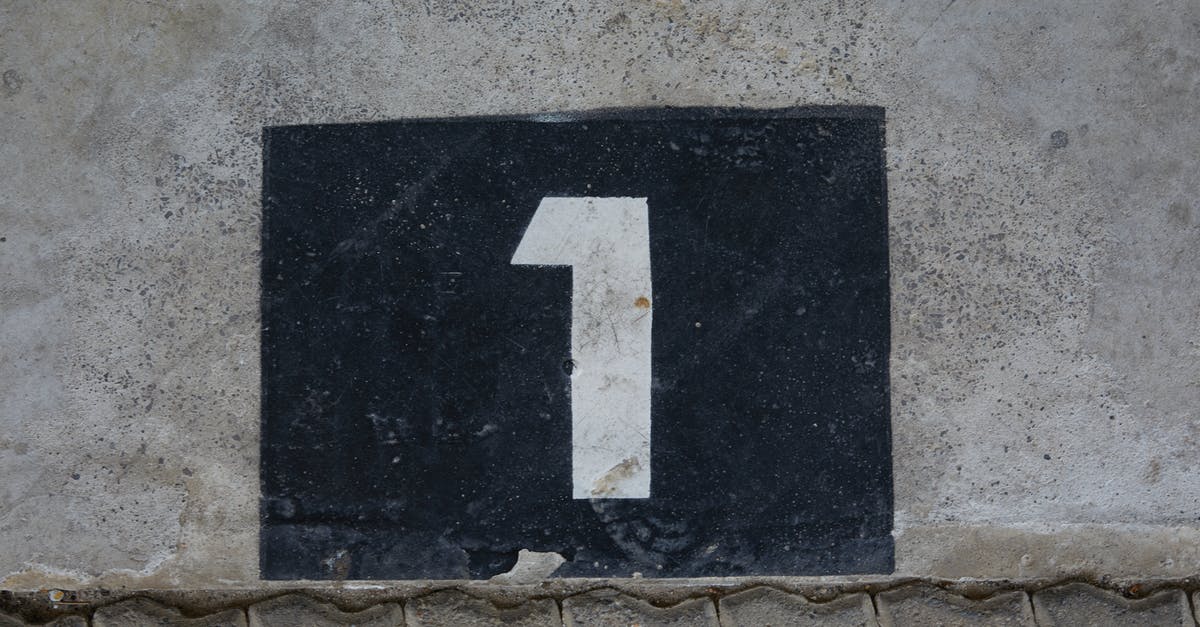 Qatar visa has old passport number - Sign with house number on wall Qatar visa has old passport number - Sign with house number on wall