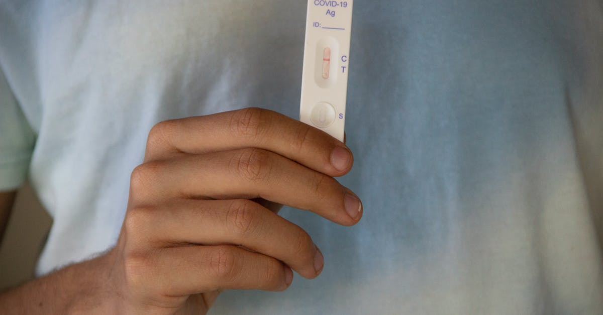 quarantining in the UK pending negative COVID-19 PCR test results - A White Covid Test at Negative Result quarantining in the UK pending negative COVID-19 PCR test results - A White Covid Test at Negative Result