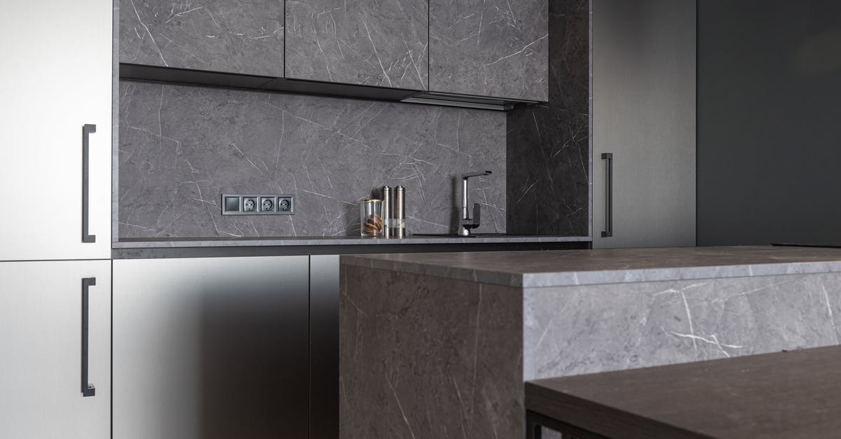 Queenstown, New Zealand private transfers - Modern kitchen with stylish gray furniture Queenstown, New Zealand private transfers - Modern kitchen with stylish gray furniture