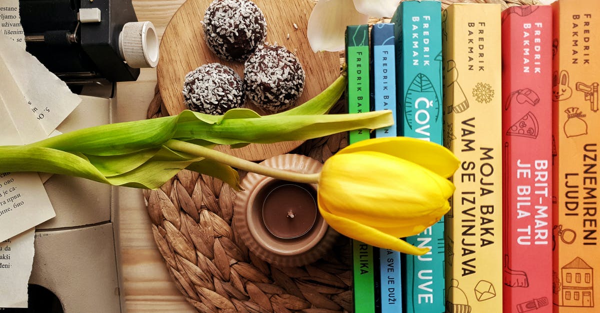 Query regarding type of room while booking - Top view stack of books on table near beautiful yellow tulip and orchid flowers arranged with chocolate truffles placed on wicker placemat Query regarding type of room while booking - Top view stack of books on table near beautiful yellow tulip and orchid flowers arranged with chocolate truffles placed on wicker placemat
