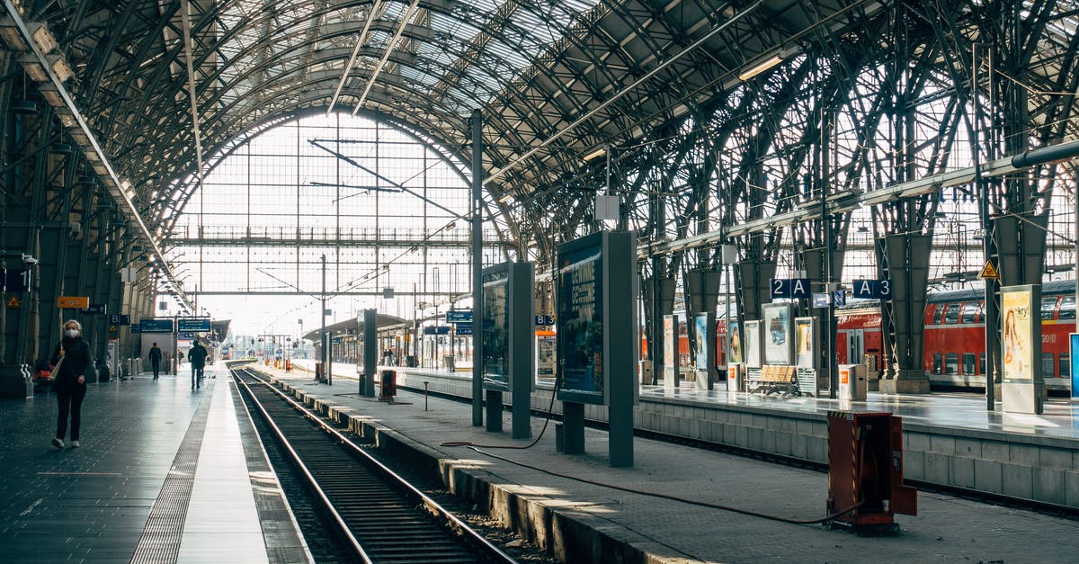 "Connection" to Darmstadt but tickets only to Frankfurt. What transportation can I take to Darmstadt and how do I prove it's paid for? - Person on a Train Station Platform