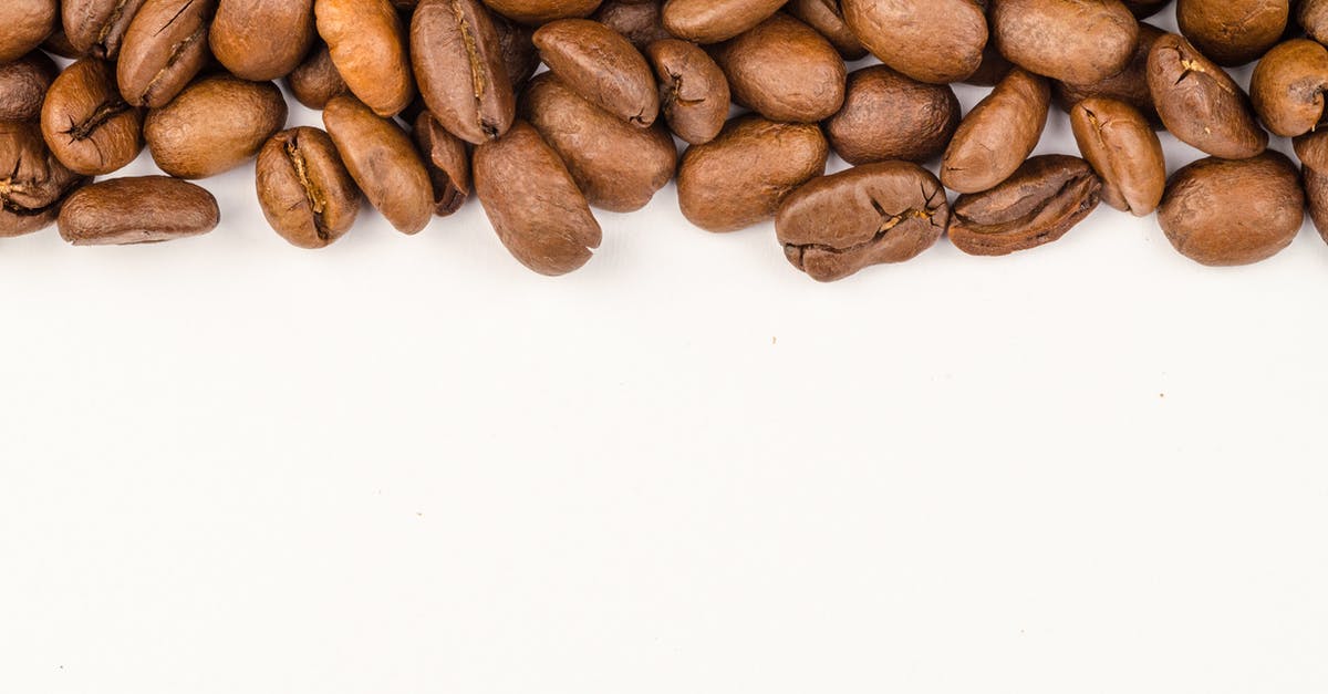 Raw grains through security - Brown Coffee Beans Raw grains through security - Brown Coffee Beans