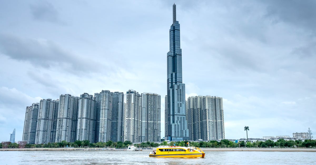 Re entering Vietnam every 90 days - Picturesque scenery of Ho Chi Minh City in Vietnam with skyscrapers and Landmark 81 building on coast with trees near water with ferry under cloudy sky in summer day Re entering Vietnam every 90 days - Picturesque scenery of Ho Chi Minh City in Vietnam with skyscrapers and Landmark 81 building on coast with trees near water with ferry under cloudy sky in summer day
