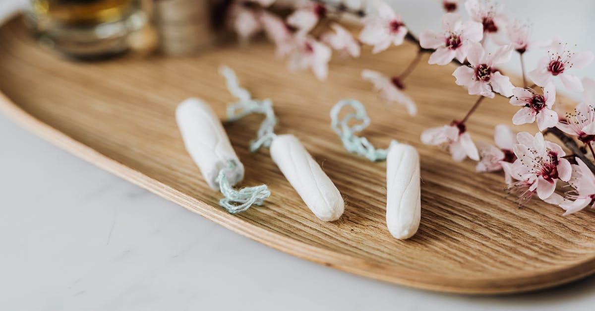 Reapply for ESTA within 90-day period for reentry to the US? [duplicate] - High angle of three menstrual tampons on bamboo plate with flower twig placed against various cosmetic products
