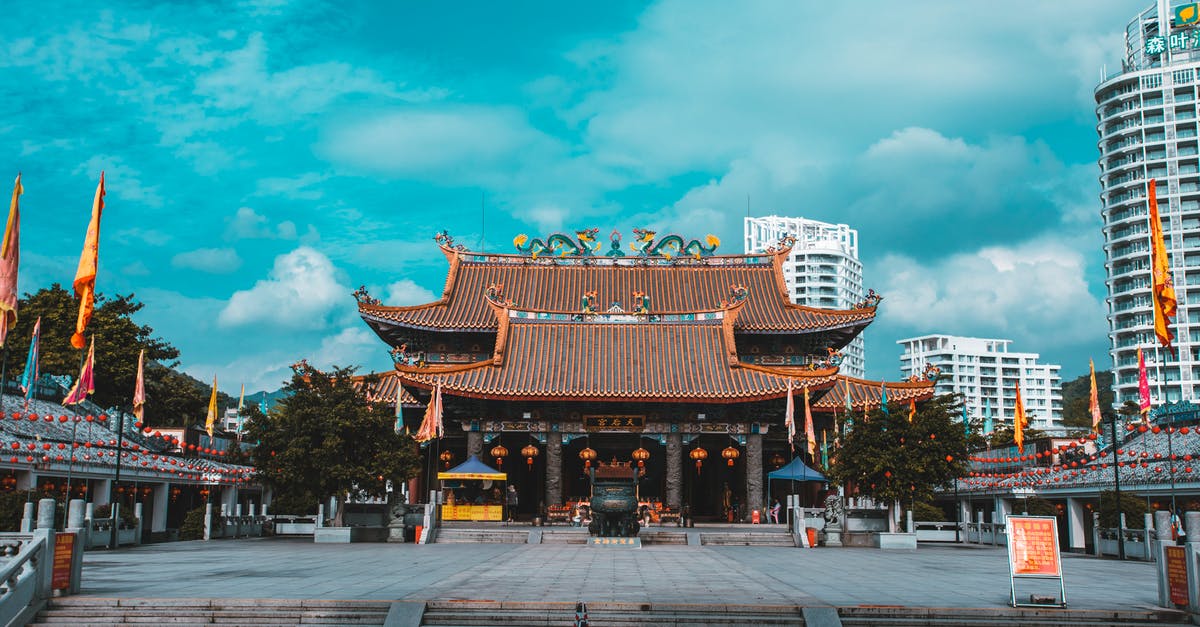 Rebooking fee for Air China - Brown and White Temple Under Blue Sky Rebooking fee for Air China - Brown and White Temple Under Blue Sky
