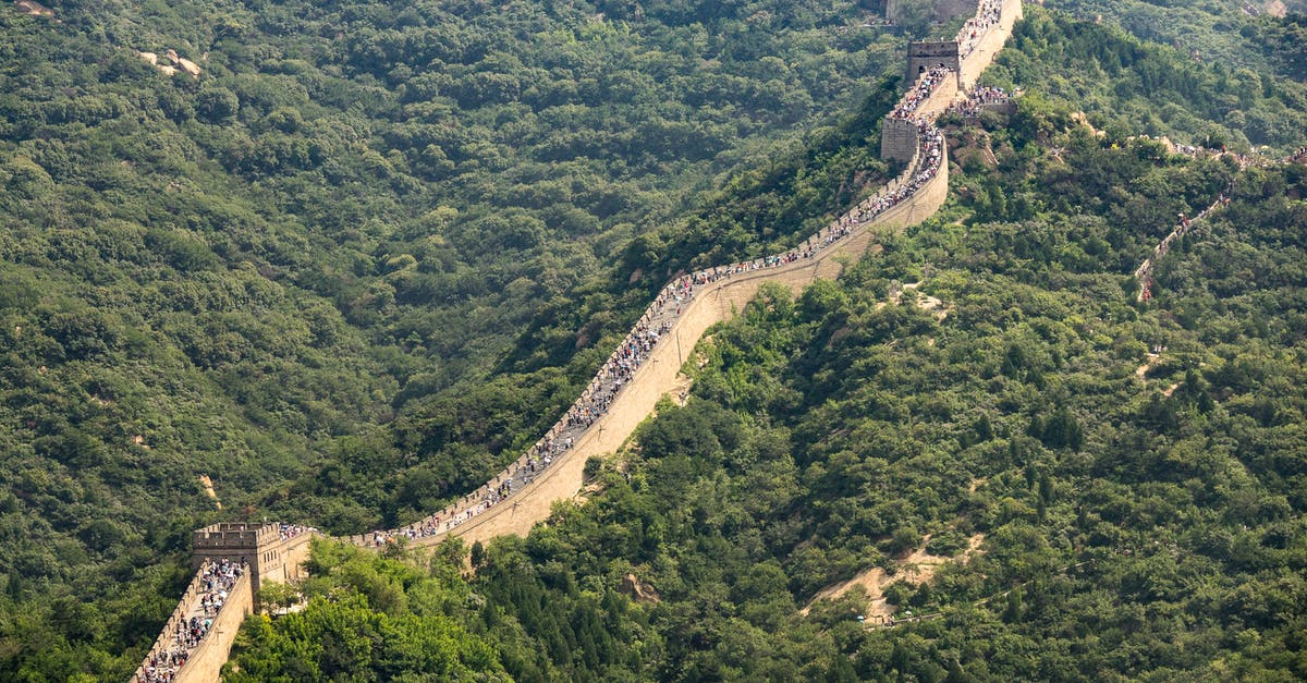 Rebooking fee for Air China - Aerial View of Green Mountains and Trees Rebooking fee for Air China - Aerial View of Green Mountains and Trees