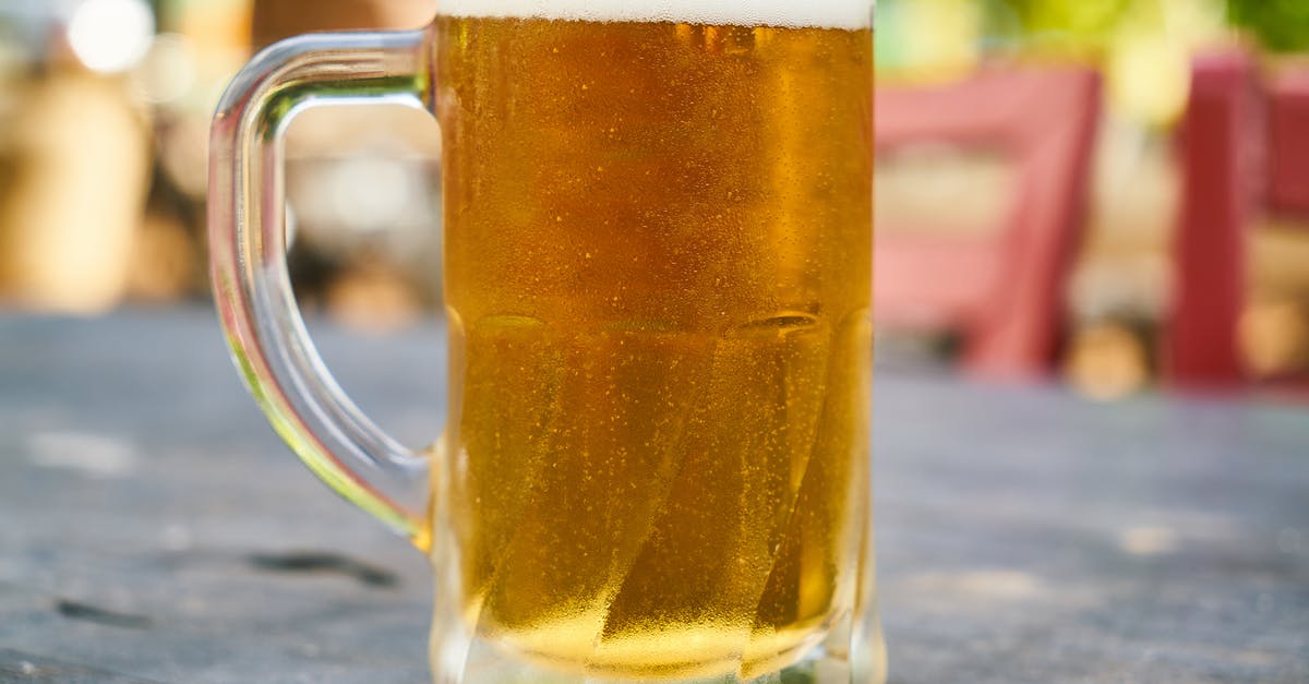 Received gestures in UK pubs: pint versus half-pint - Beer Filled Mug on Table Received gestures in UK pubs: pint versus half-pint - Beer Filled Mug on Table