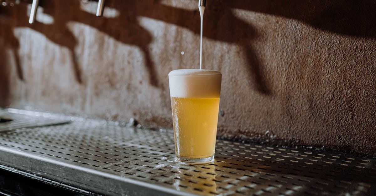Received gestures in UK pubs: pint versus half-pint - Beer Pouring Into Clear Drinking Glass on Metal Surface Received gestures in UK pubs: pint versus half-pint - Beer Pouring Into Clear Drinking Glass on Metal Surface