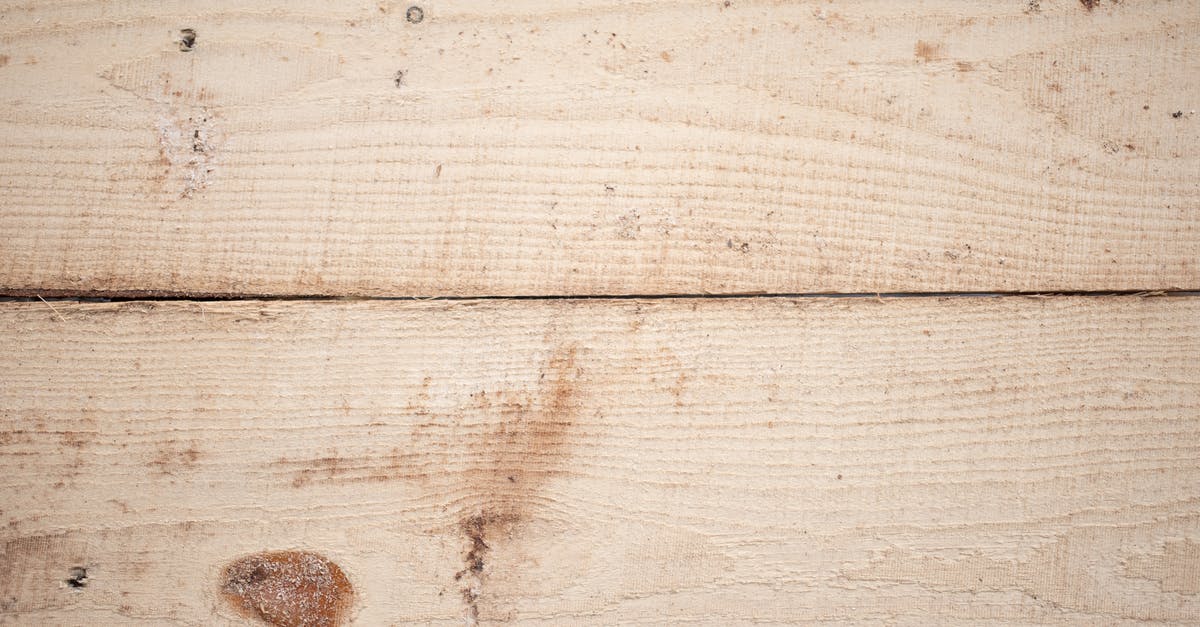 Receiving hard copy tier 2 CoS after UKVI panel sits on 11th [closed] - Background of textured surface of wooden boards with linear pattern and brown spots