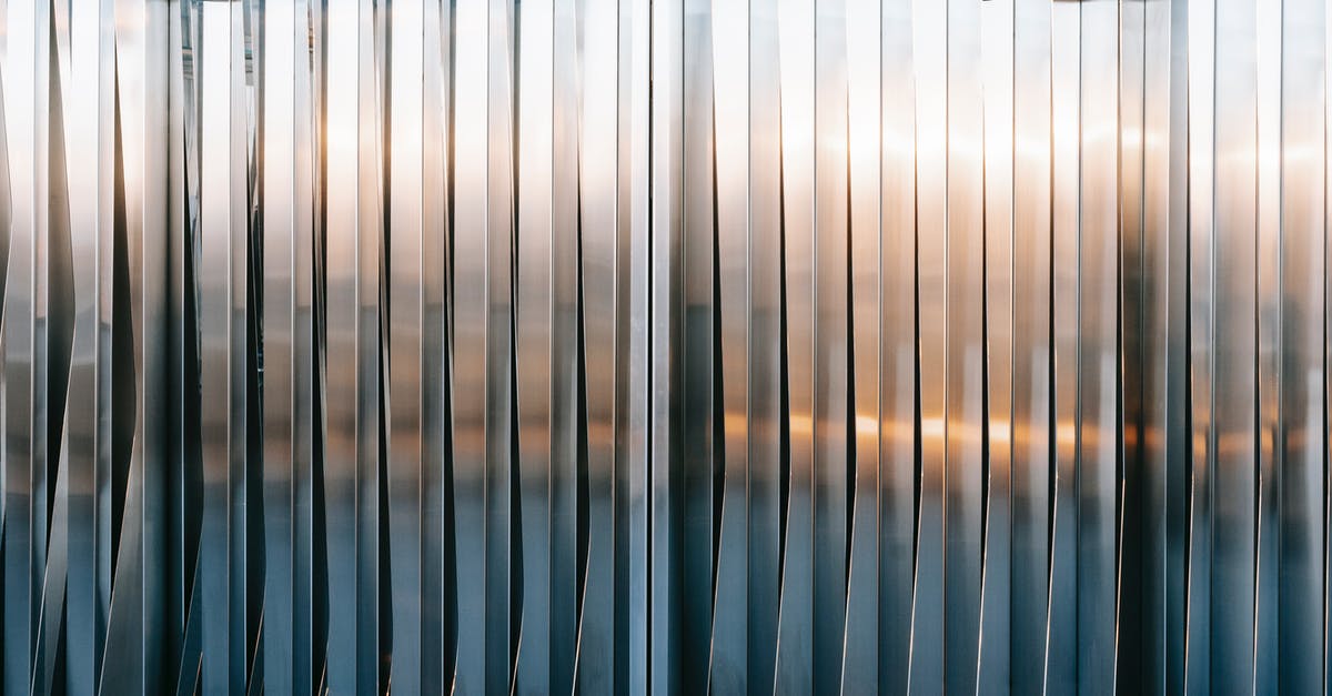 Receiving hard copy tier 2 CoS after UKVI panel sits on 11th [closed] - Closed metal gates with uneven surface