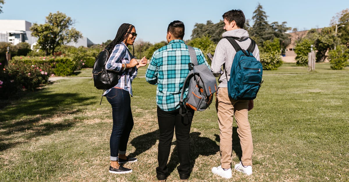Re-check/check bags T5 to T3 on a separate itinerary - Man in Blue and White Plaid Dress Shirt Standing Beside Woman in Black Pants Re-check/check bags T5 to T3 on a separate itinerary - Man in Blue and White Plaid Dress Shirt Standing Beside Woman in Black Pants