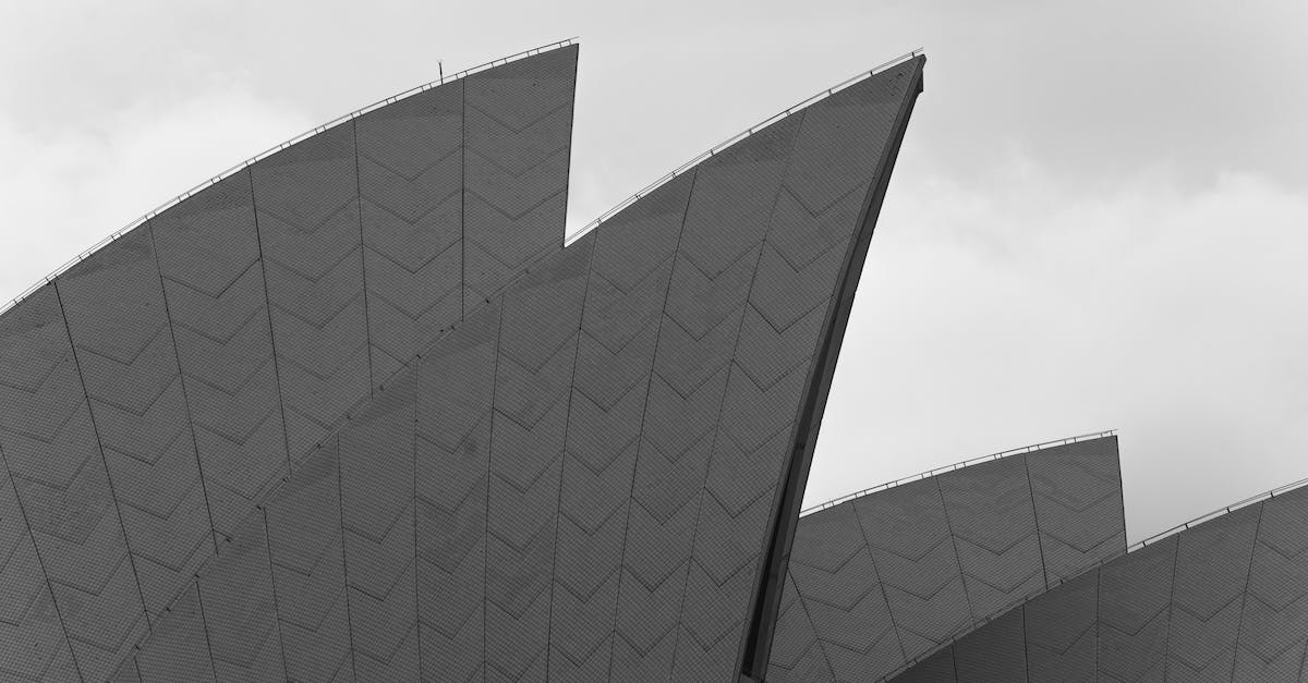 Recommendation engines for tourism attractions? - Modern futuristic building roof against cloudy sky Recommendation engines for tourism attractions? - Modern futuristic building roof against cloudy sky