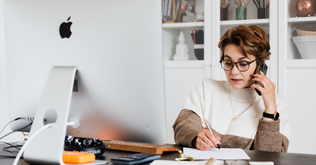 Recommendation for mobile prepaid SIM card for smartphone + home calls in Germany - Serious lady talking on smartphone and taking notes on paper Recommendation for mobile prepaid SIM card for smartphone + home calls in Germany - Serious lady talking on smartphone and taking notes on paper